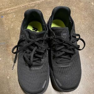 All black Nike Free running shoes
